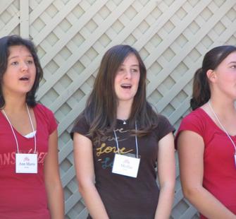 Young women singing their number.
